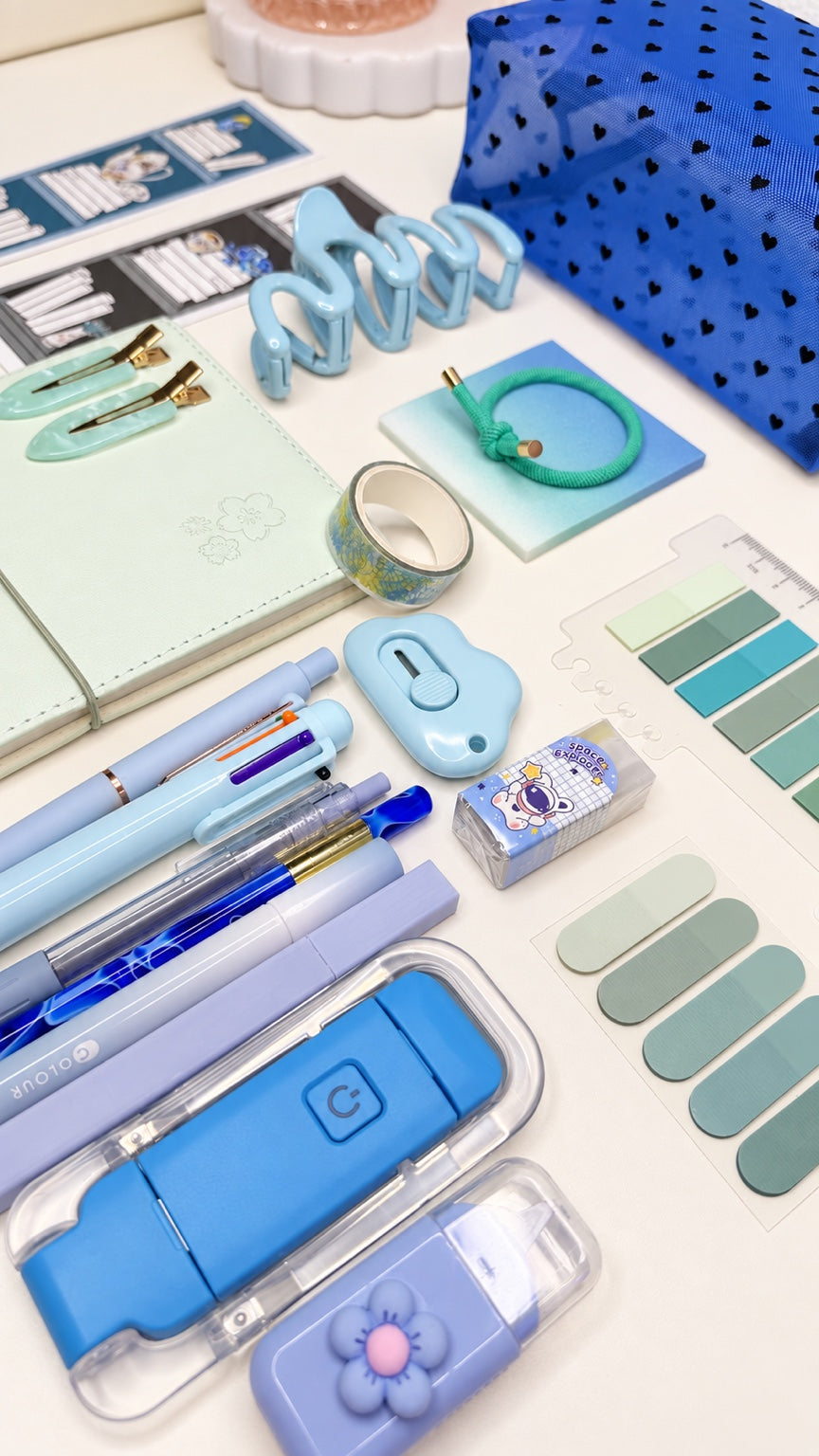 Blue stationery gift set with coordinated blue, mint, and lavender desk accessories
