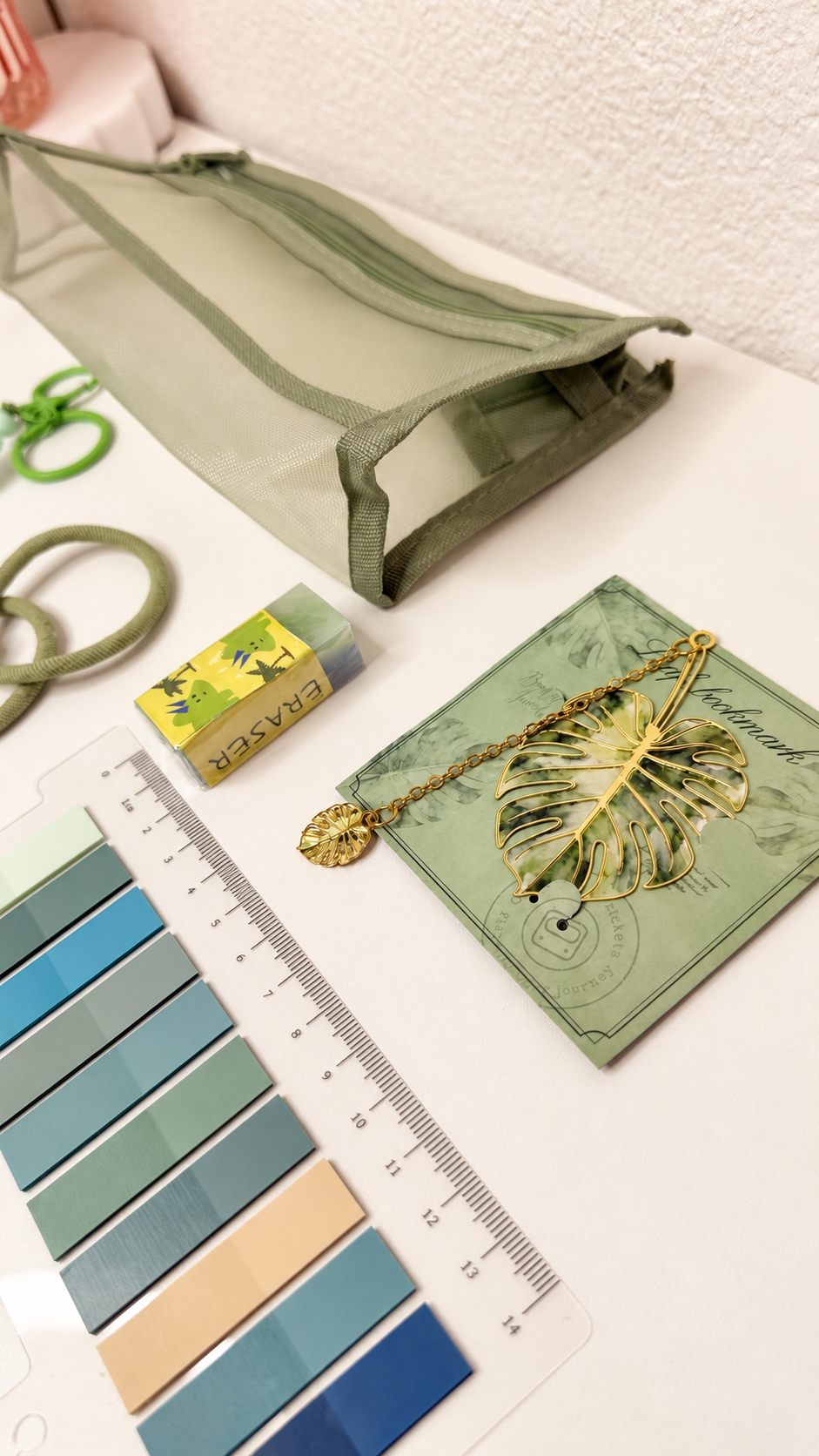 Green stationery set accessories and leaf bookmark