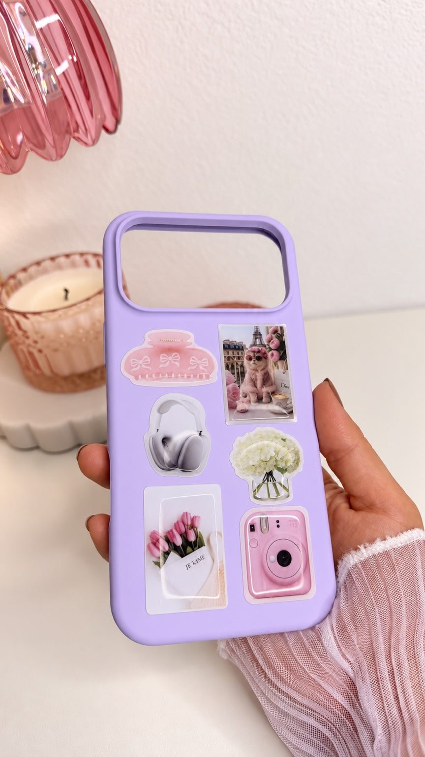 Purple silicone iPhone 17 Pro Max case decorated with pink lifestyle stickers